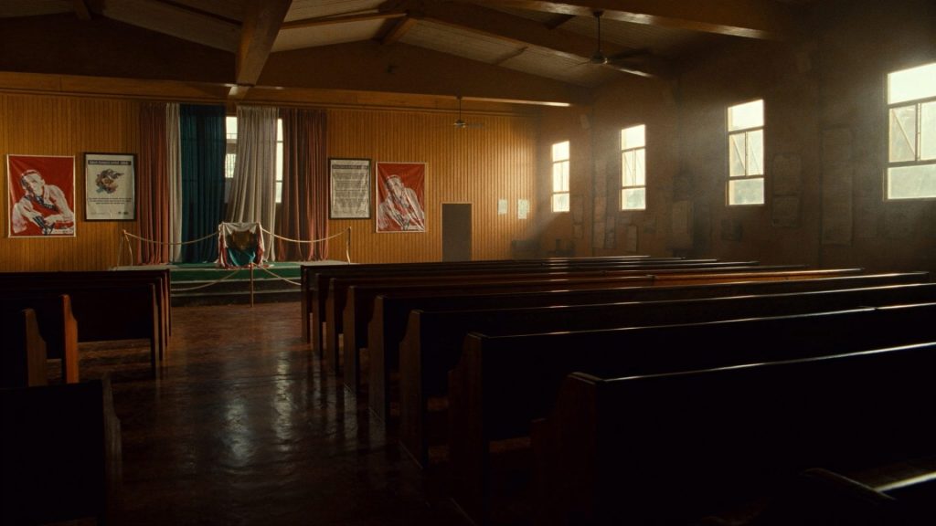 Empty church sanctuary and fellowship hall with wooden pews, ready for the fall program year